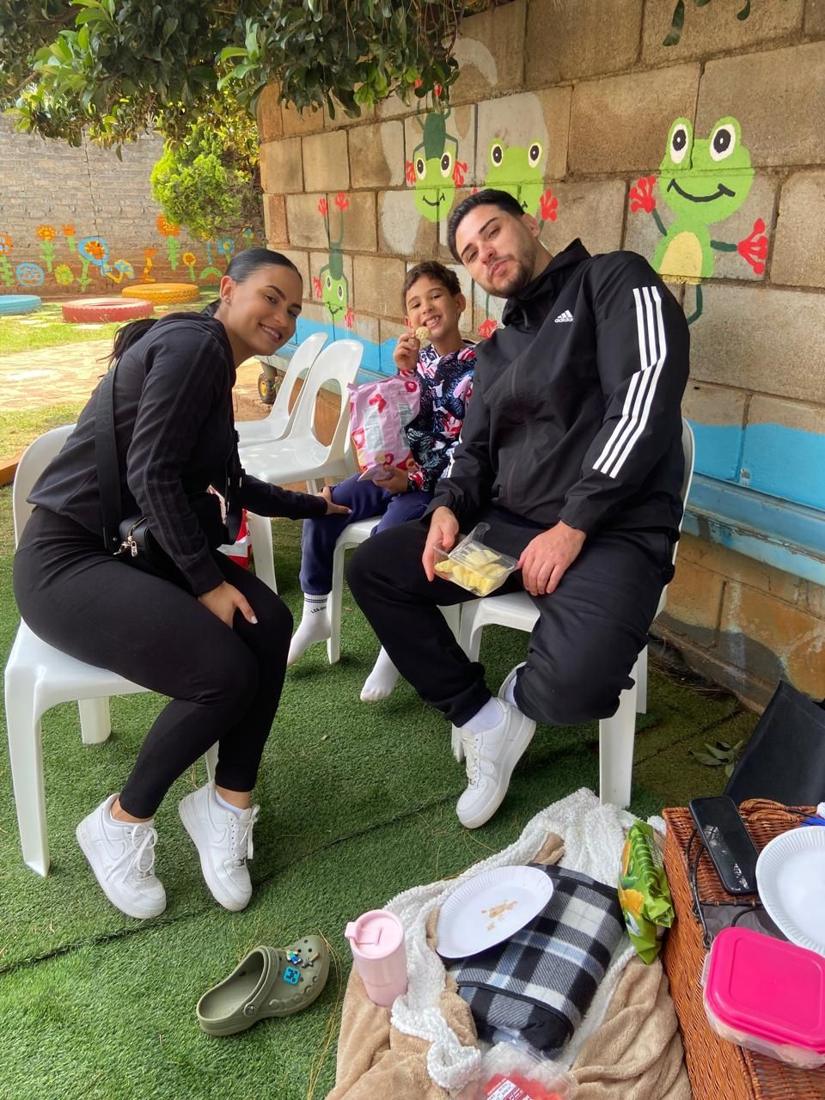 A family enjoying a picnic in the garden