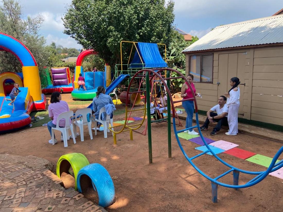 The playground with jungle gym, swings and jumping castles